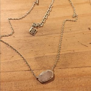 Gold iridescent Kendra Scott necklace.