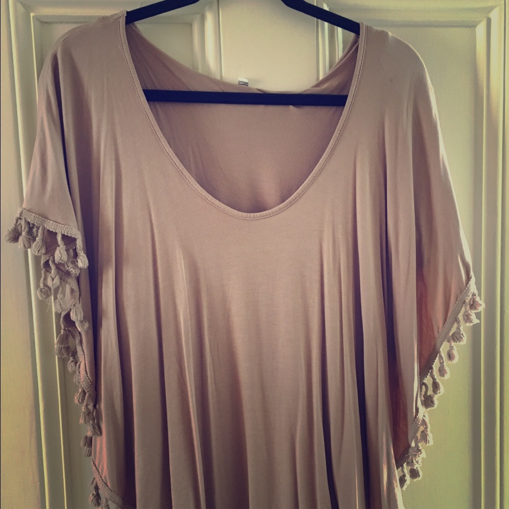 Tan fringe poncho from Anthropologie