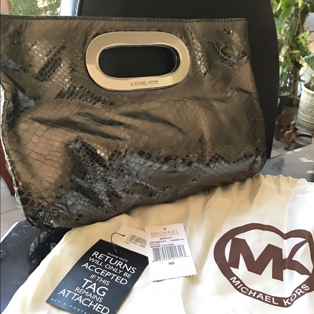 Brand new with tags Michael Kors Gunmetal Clutch.