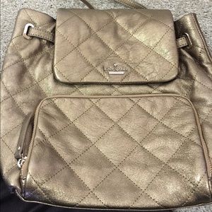 Gold Kate Spade backpack.