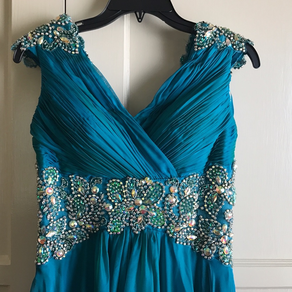 Iridescent teal gown with gems