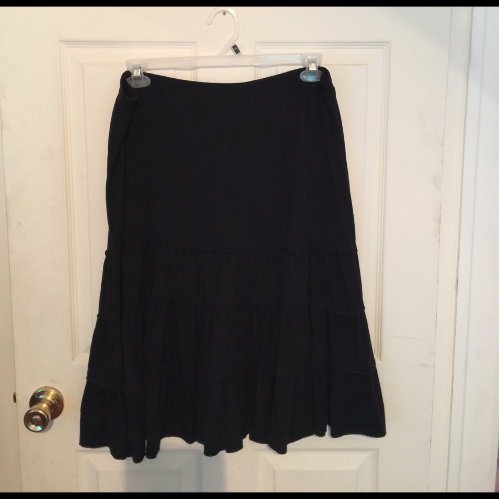 Black cotton blend pull on skirt.