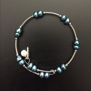 Silver plated bracelet with blue pearls