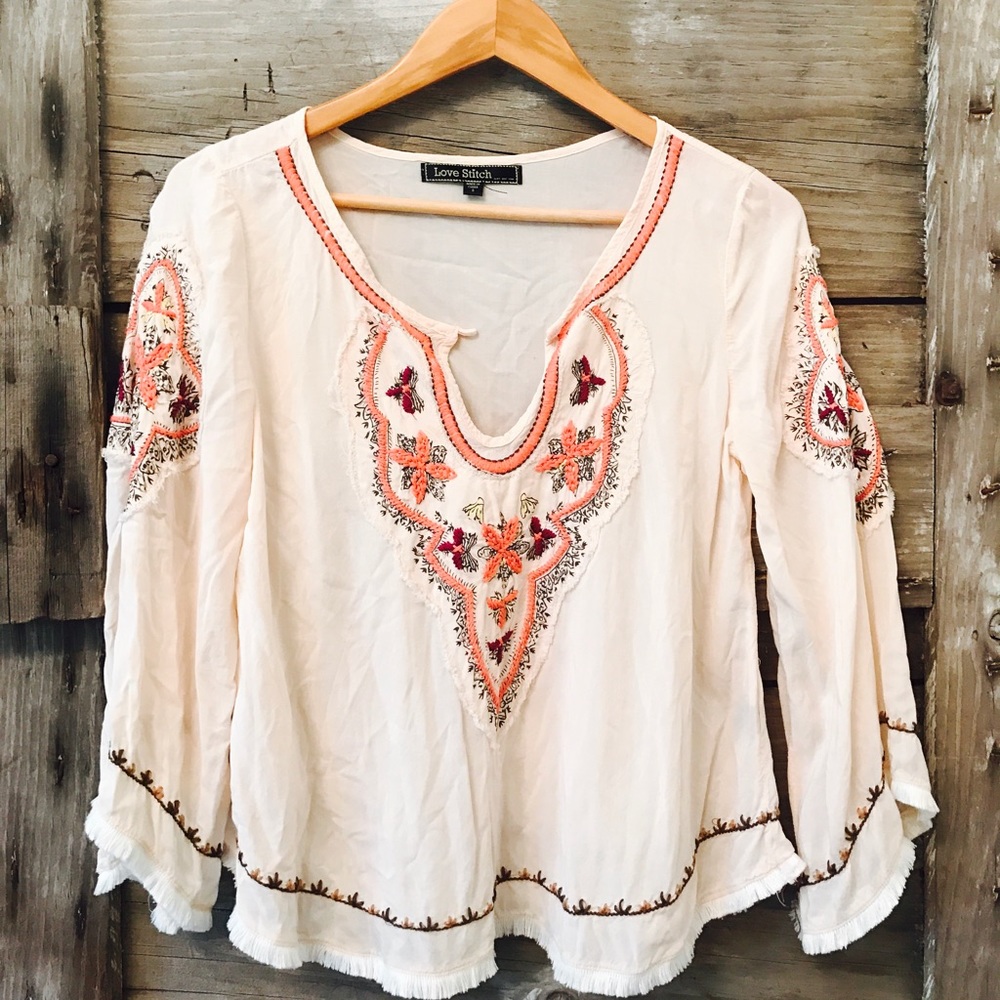 Embroidered flowy blouse with frayed bell sleeves!