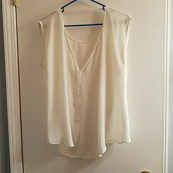 Cream colored flowy kind of see-through shirt. - Picture 2 of 2