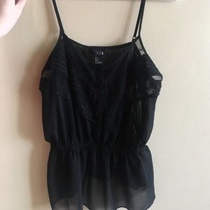 Black sheer peplum tank top with lace detail