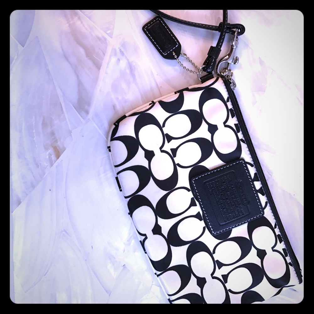 Coach wristlet with branding in black and white