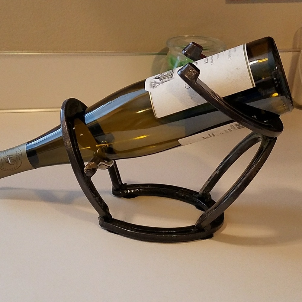Horseshoe and bit wine bottle display