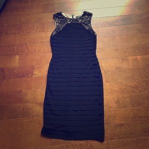 Form-fitting black dress.