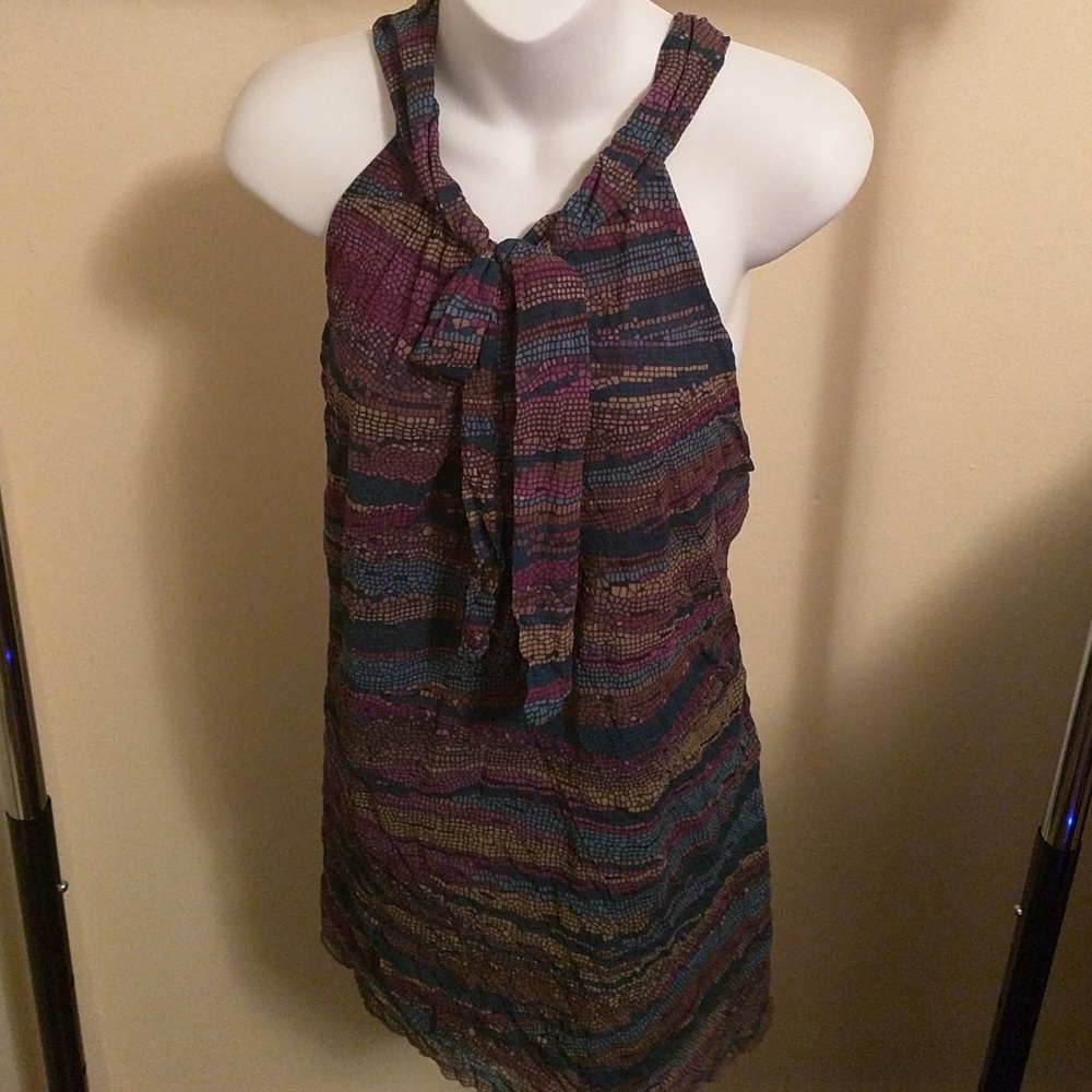 Colorful sleeveless top with bow at neck or V neck