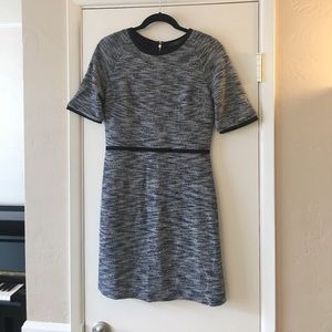 Blue tweed dress with black contrast piping.