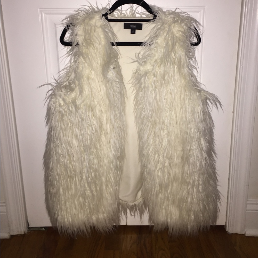 White fur vest