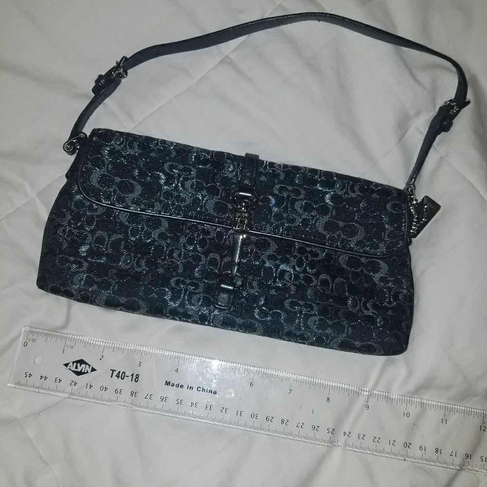 Silver and Black Coach shoulder bag with clasp