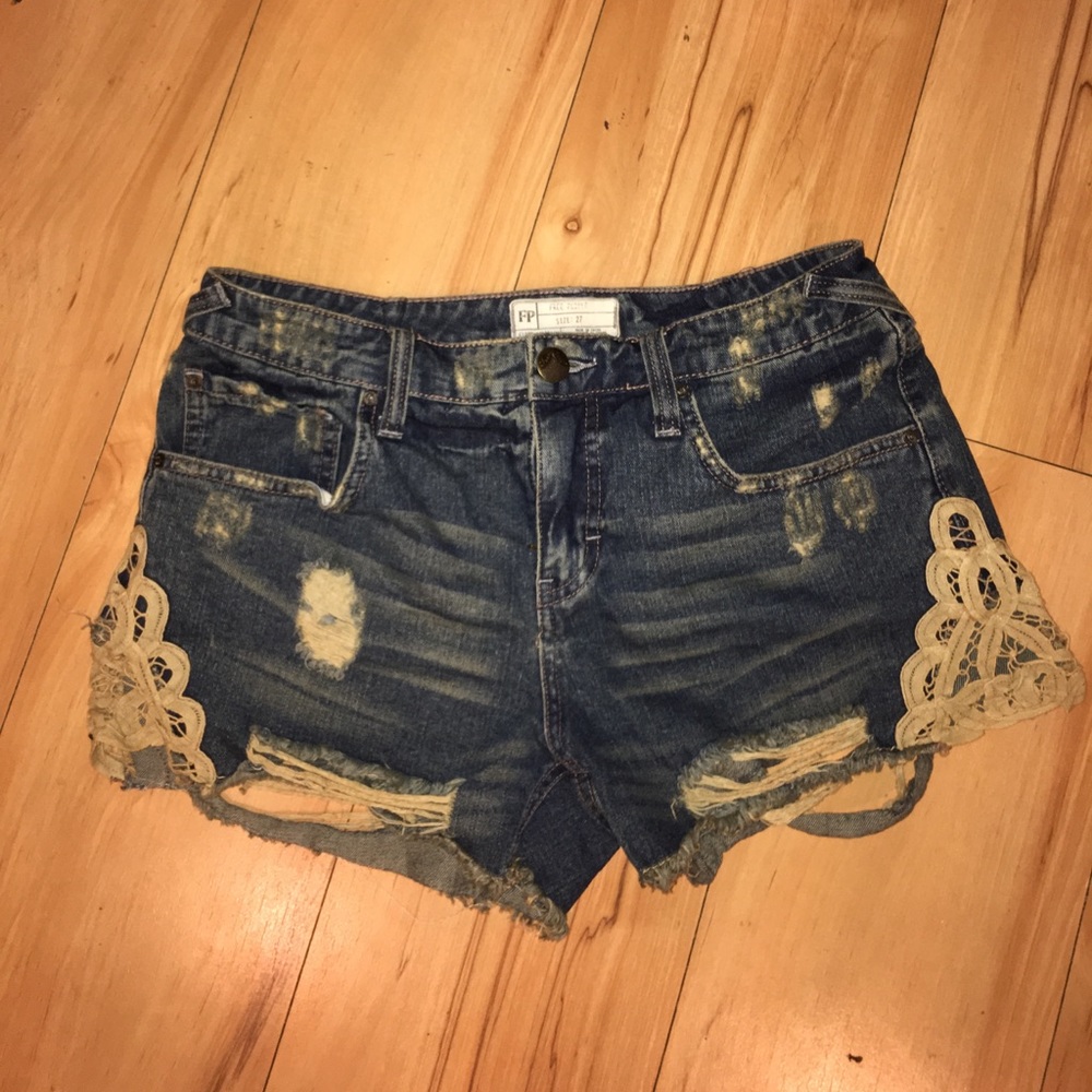 Distressed high waisted shorts with lace detail