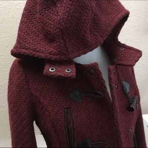Red hooded woven jacket with toggles