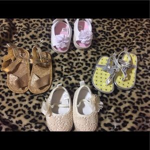 Four pairs of baby shoes