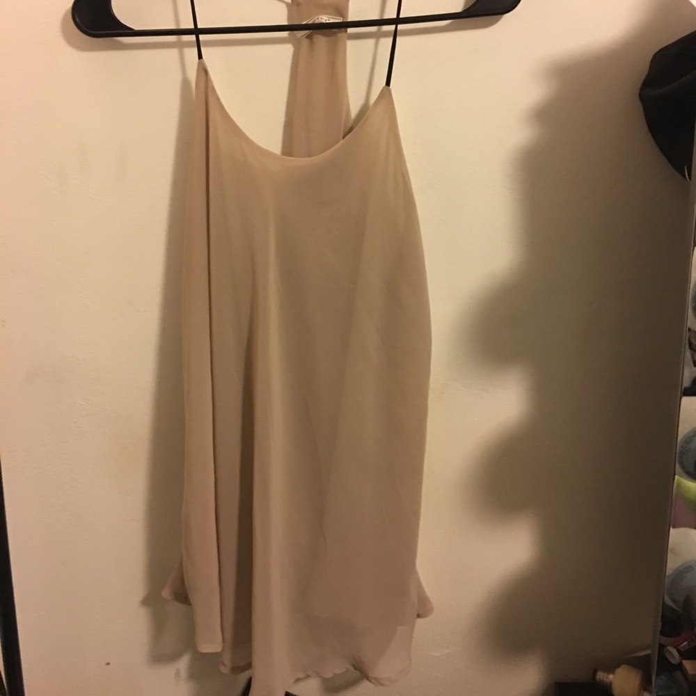 Sheer sleeveless top.