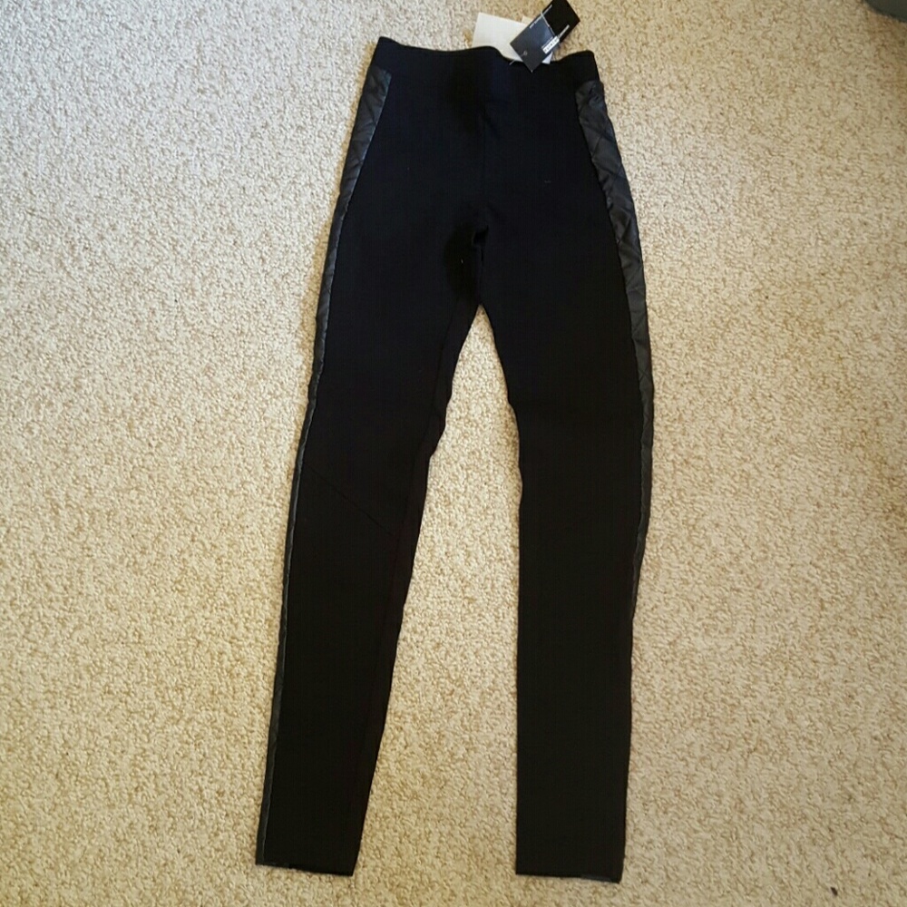 Black leggings with leather accent.