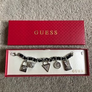 GUESS silver and black charm bracelet.