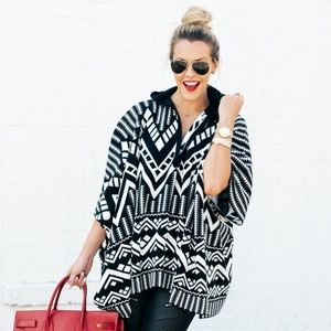 Express one size black and white poncho.