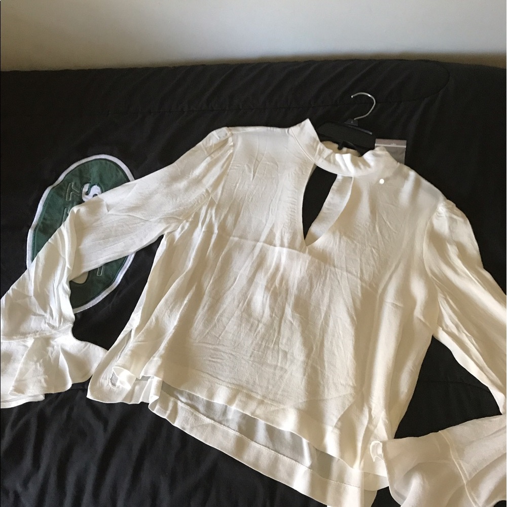 Runs small never worn extra button still attached