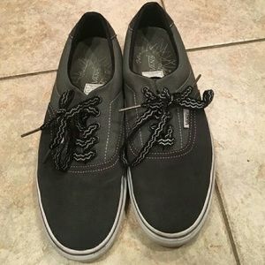 Black and gray Vans.