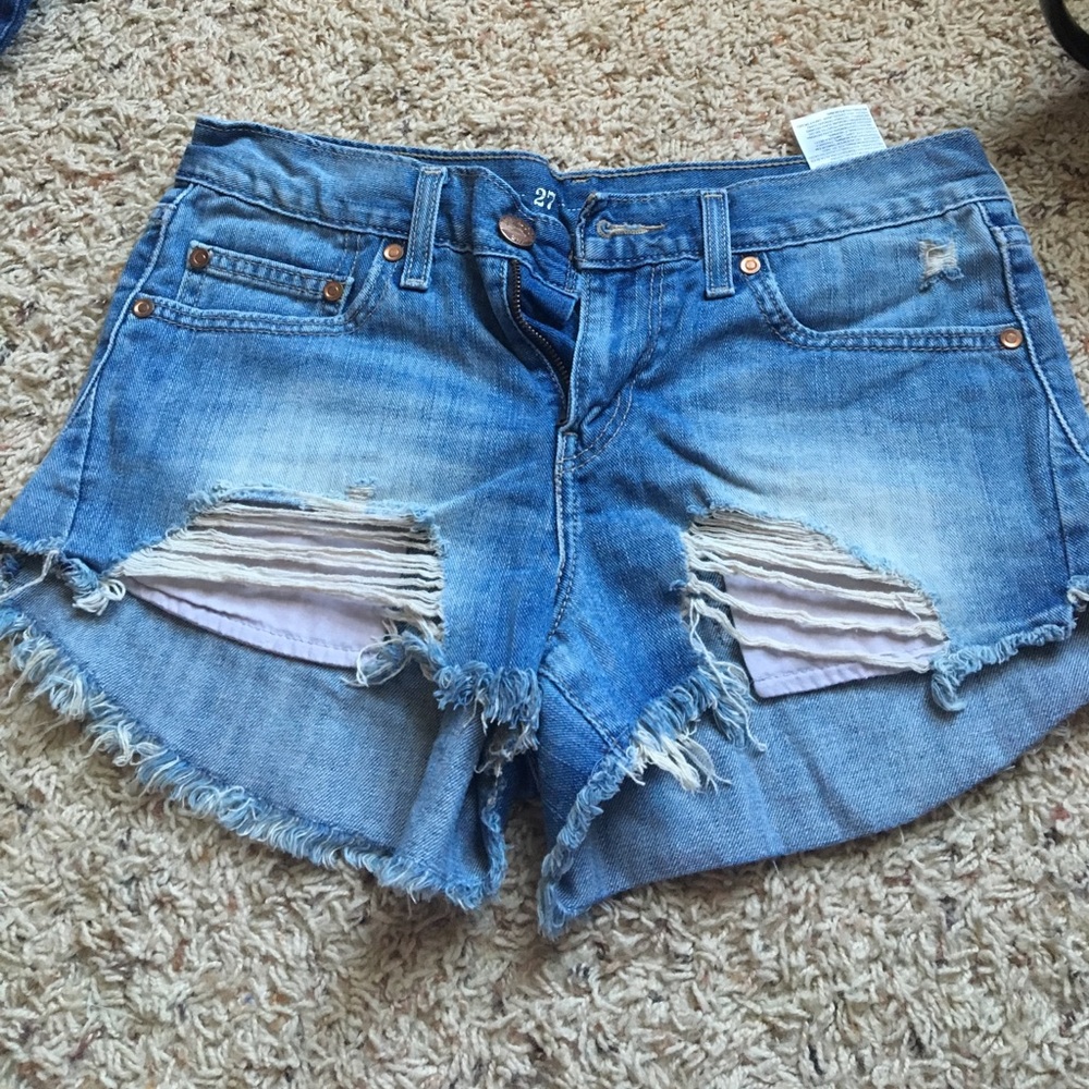 Levi high waisted distressed jean shorts.