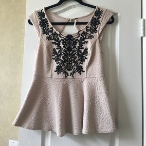 Blush free people peplum top with black details