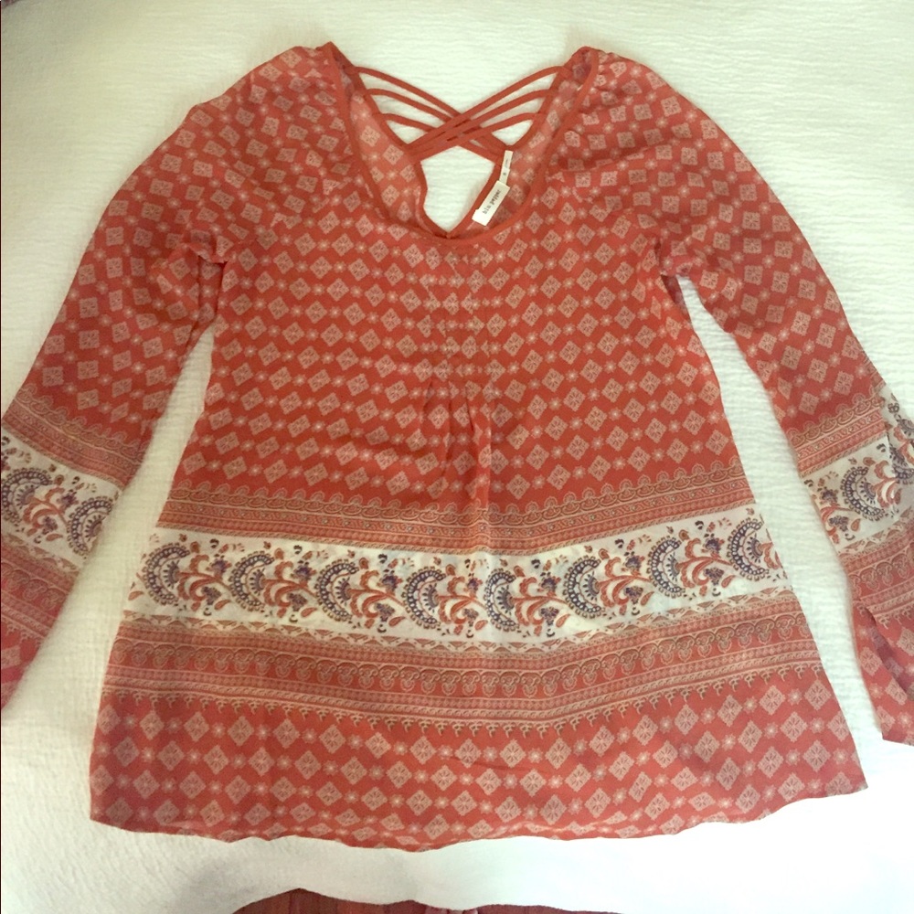 Rust printed blouse with criss cross back detail