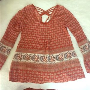 Rust printed blouse with criss cross back detail