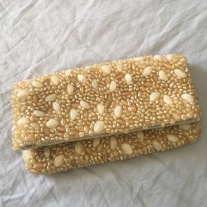 Beaded beige Banana Repulic folded clutch