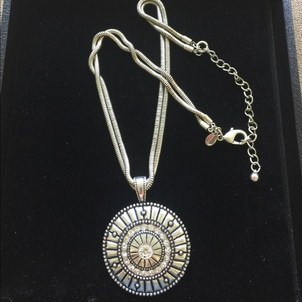 Unique silver colored metal necklace.