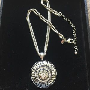 Unique silver colored metal necklace.