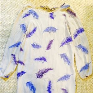 Long sleeved mini dress with feather pattern.