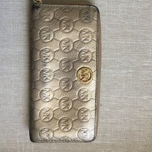 Micheal Kors gold wristlet wallet