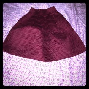 Maroon 85% polyester 15% spandex skirt.