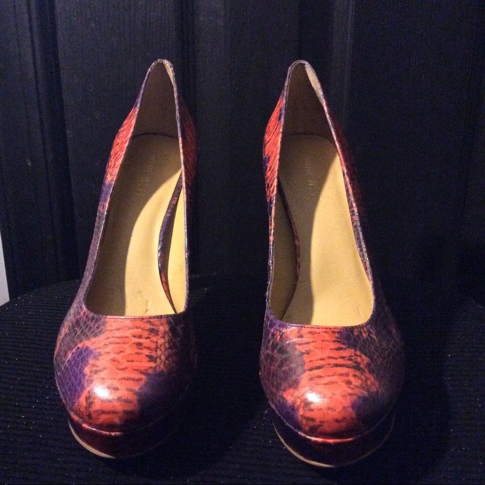 Nine West Snake skin pumps.