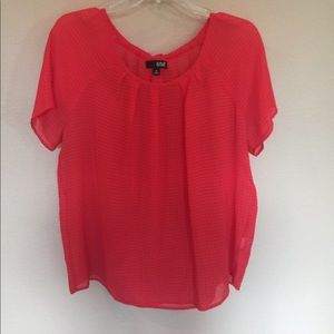 Reddish orange blouse