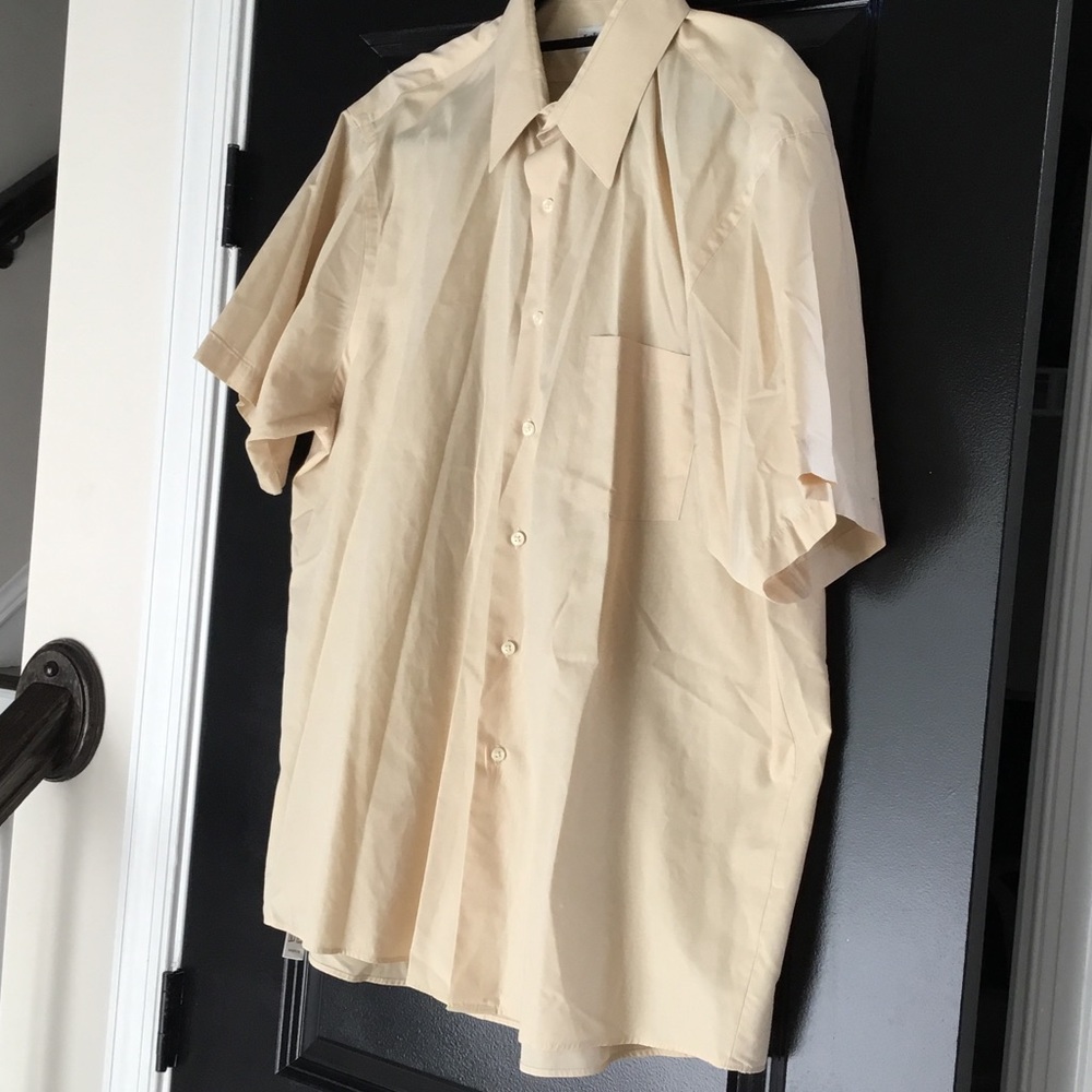Light yellow short sleeve shirt.