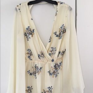 Cream cut out romper with sequin floral accents