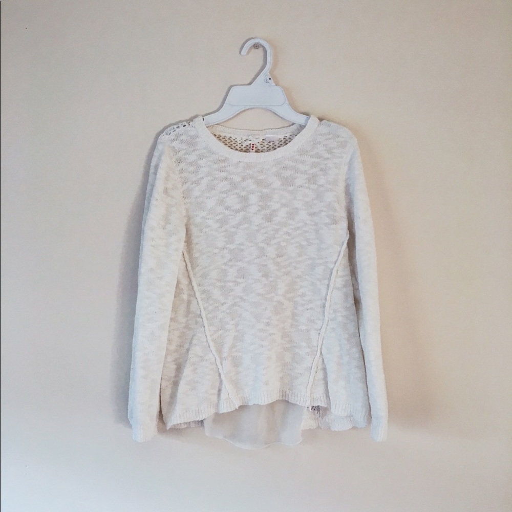 White sweater with sheer back.