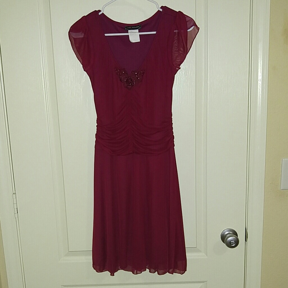 Beautiful dark red dress.