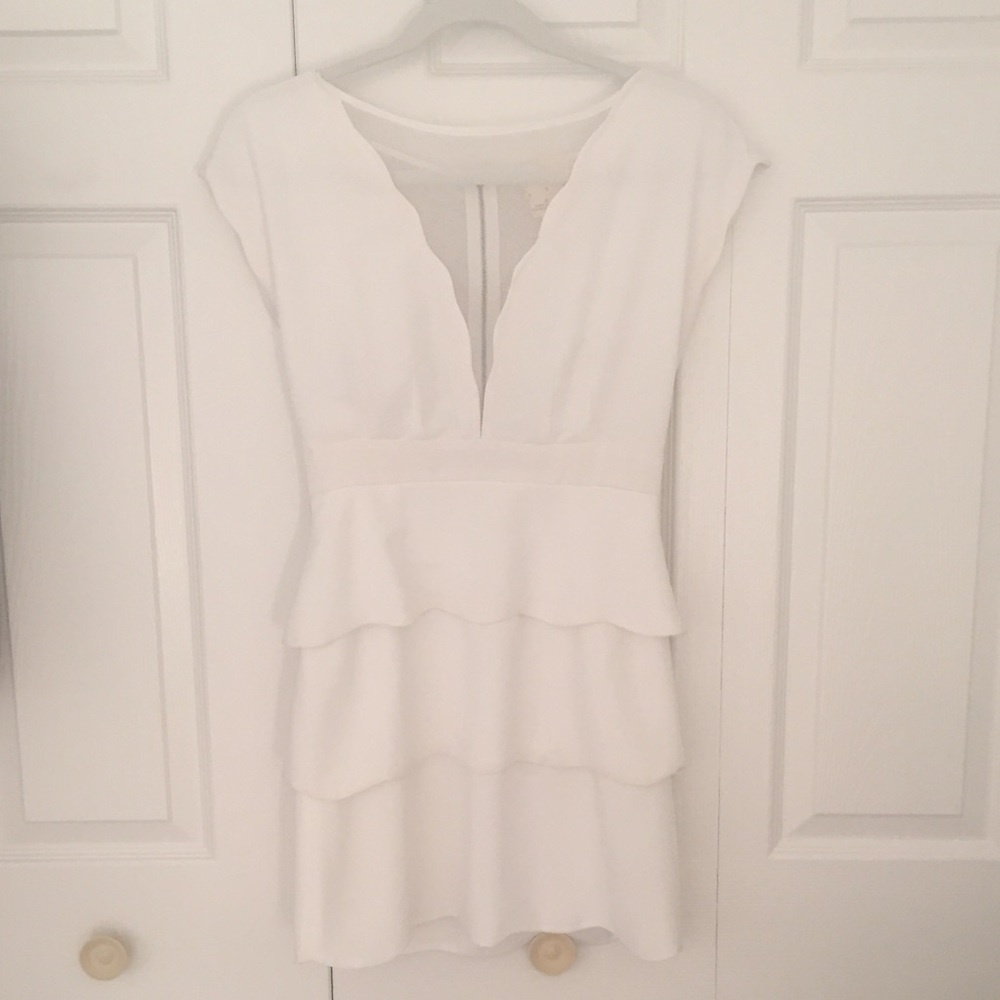 White, short-sleeved semi-formal dress.