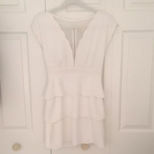White, short-sleeved semi-formal dress.