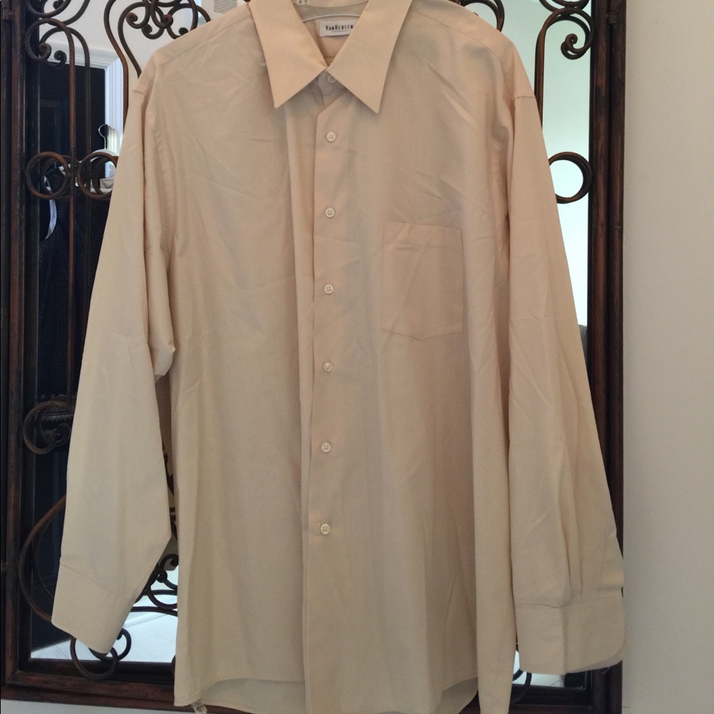 Pale yellow button down shirt.