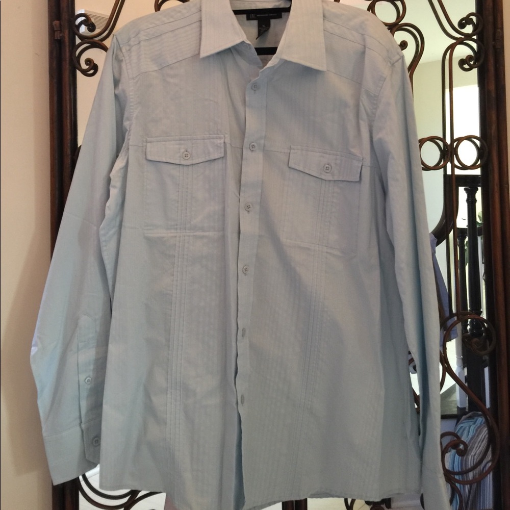 Baby blue shirt.