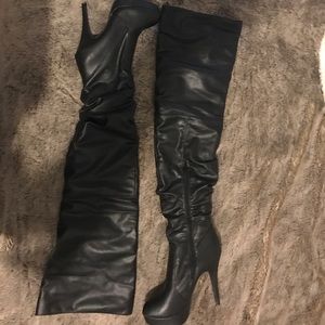 Black high heeled boots. Size 8