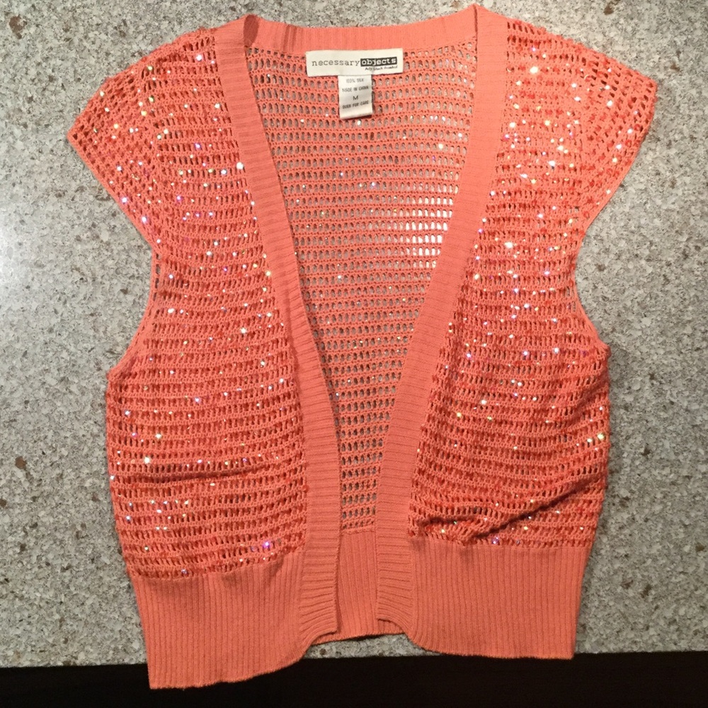 Orange cap sleeve sequence shrug.