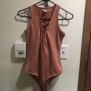 Pink suede body suit
