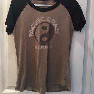 This is a off-green colored t-shirt.